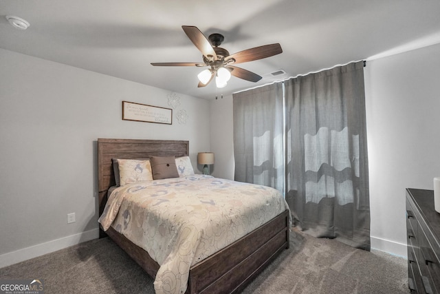 bedroom featuring ceiling fan, dark colored carpet, visible vents, and baseboards