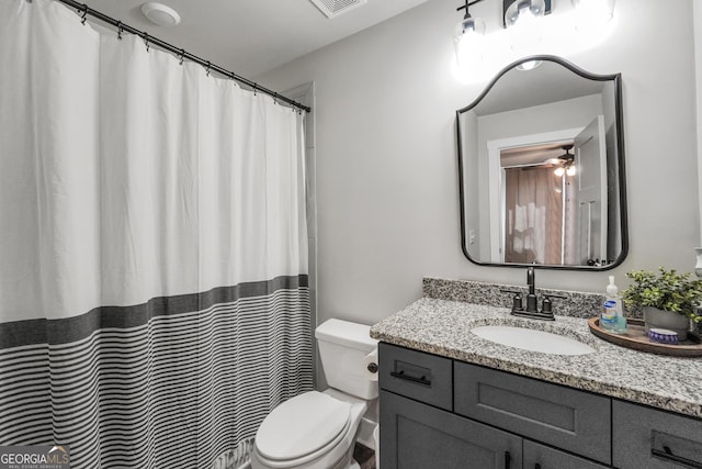 full bathroom with toilet, a ceiling fan, and vanity