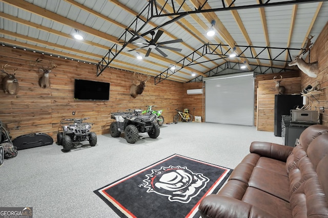 living area featuring a garage, lofted ceiling, ceiling fan, metal wall, and carpet