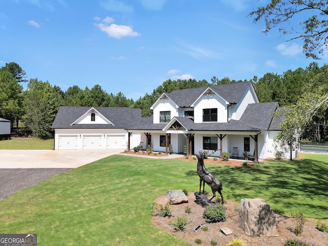 modern farmhouse style home with a porch, an attached garage, concrete driveway, board and batten siding, and a front yard