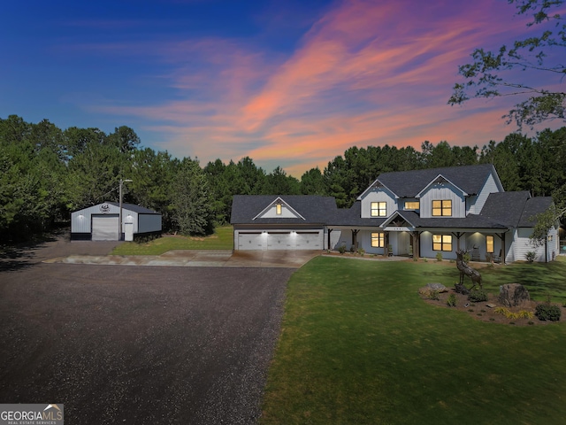 modern farmhouse style home featuring a front yard and concrete driveway