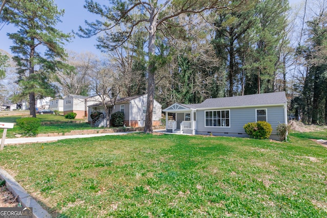 ranch-style house featuring crawl space, covered porch, and a front yard