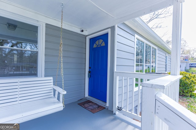 property entrance featuring a porch