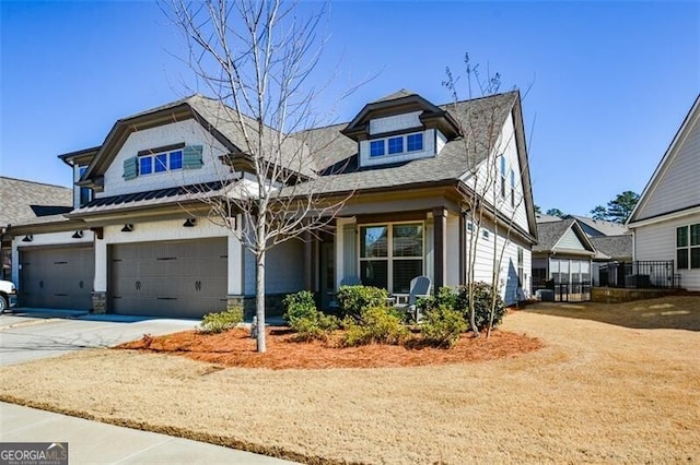 craftsman house featuring driveway and an attached garage