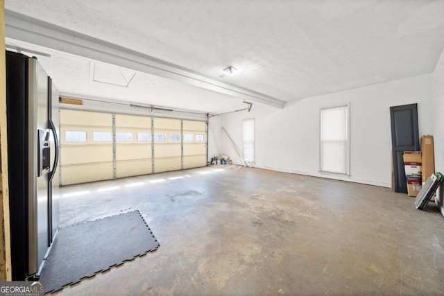 garage with refrigerator with ice dispenser