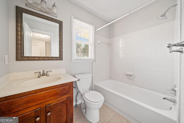 bathroom featuring toilet, vanity, washtub / shower combination, and tile patterned floors