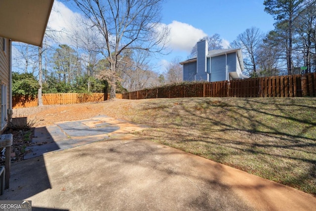 view of yard featuring a patio and fence