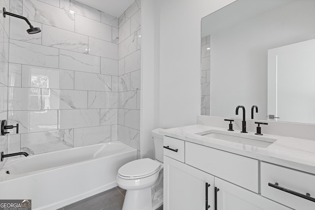 bathroom featuring toilet, shower / bathing tub combination, and vanity