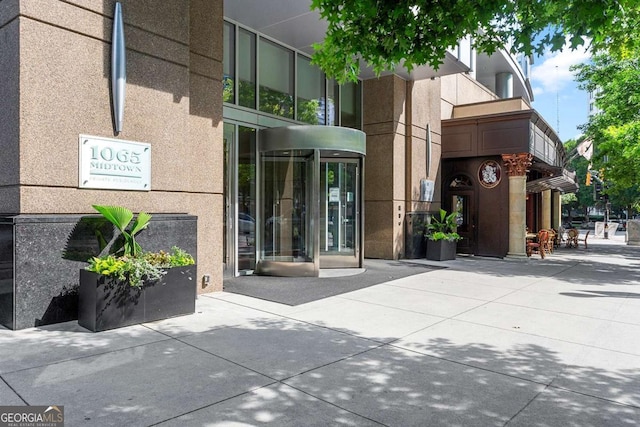 entrance to property featuring stucco siding