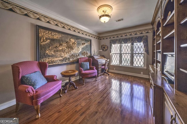 520 Camp Perrin Rd, Lawrenceville, GA 30043 - living area featuring dark wood-type flooring, visible vents, ornamental molding, and baseboards