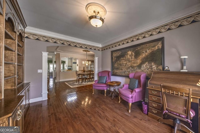 520 Camp Perrin Rd, Lawrenceville, GA 30043 - sitting room featuring decorative columns, baseboards, arched walkways, ornamental molding, and dark wood-style flooring