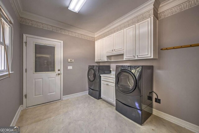 520 Camp Perrin Rd, Lawrenceville, GA 30043 - laundry room with ornamental molding, washer and dryer, cabinet space, and baseboards