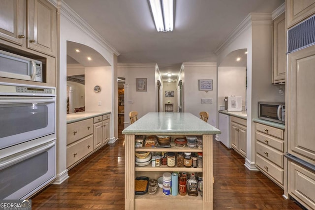 520 Camp Perrin Rd, Lawrenceville, GA 30043 - kitchen with open shelves, white appliances, a kitchen island, and light countertops