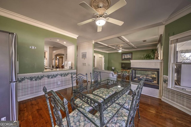520 Camp Perrin Rd, Lawrenceville, GA 30043 - dining room featuring dark wood-style floors, arched walkways, ceiling fan, and a multi sided fireplace