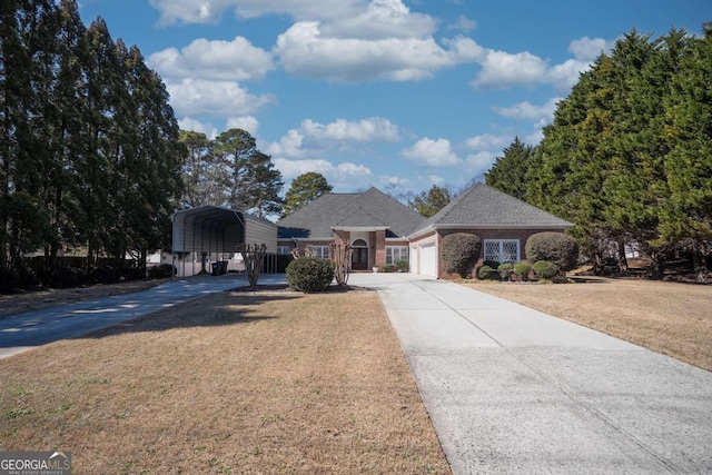 view of front of house with a carport, a garage, a front lawn, and concrete driveway