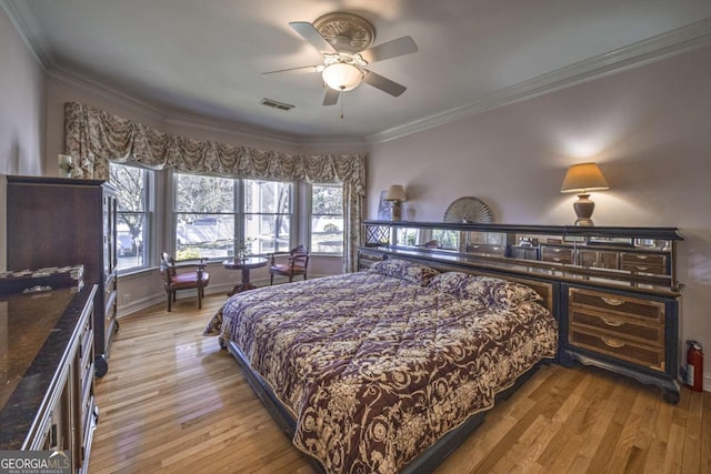 520 Camp Perrin Rd, Lawrenceville, GA 30043 - bedroom featuring ornamental molding, light wood finished floors, visible vents, and baseboards