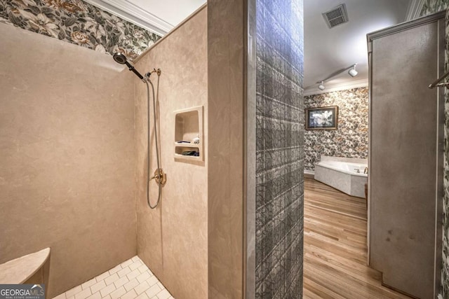 520 Camp Perrin Rd, Lawrenceville, GA 30043 - bathroom with a bath, ornamental molding, a tile shower, and visible vents