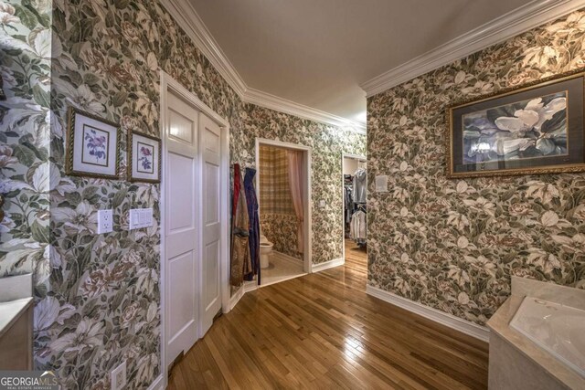 520 Camp Perrin Rd, Lawrenceville, GA 30043 - hall with baseboards, crown molding, hardwood / wood-style floors, and wallpapered walls