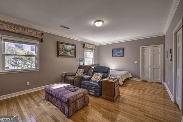 520 Camp Perrin Rd, Lawrenceville, GA 30043 - bedroom with baseboards, visible vents, crown molding, and light wood finished floors