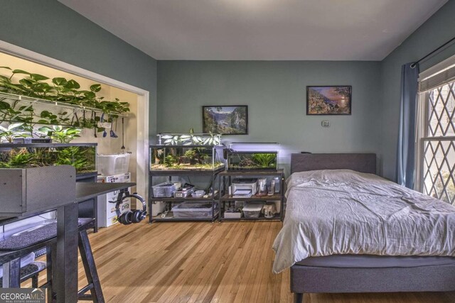 520 Camp Perrin Rd, Lawrenceville, GA 30043 - bedroom featuring wood finished floors