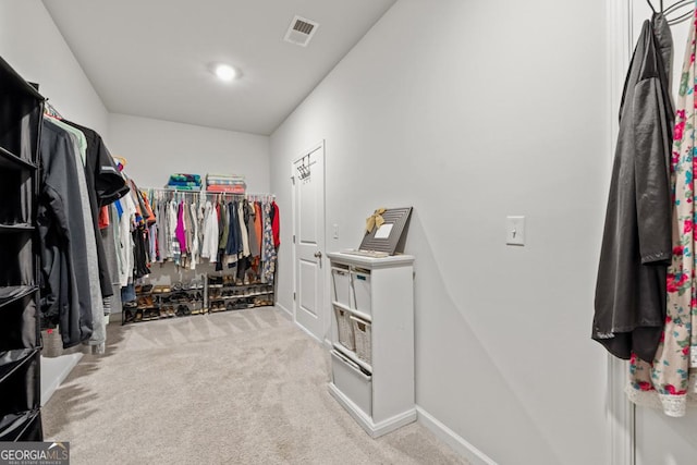 walk in closet featuring carpet floors and visible vents