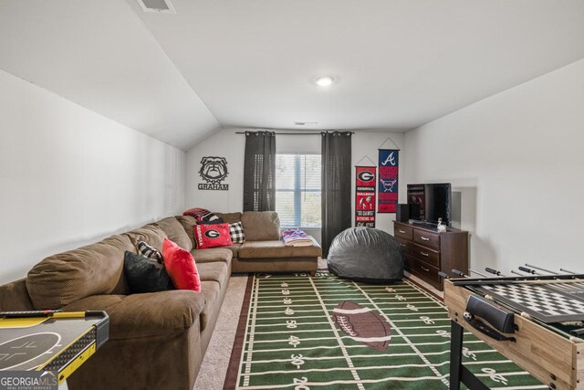 living area with vaulted ceiling