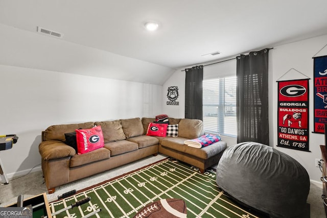 living room featuring lofted ceiling, carpet floors, and visible vents