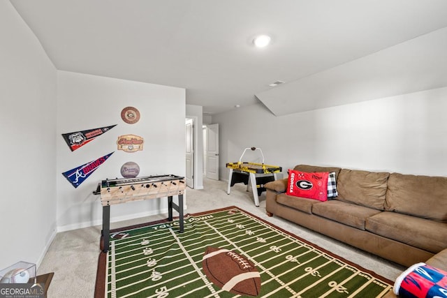 living area with carpet, visible vents, and baseboards