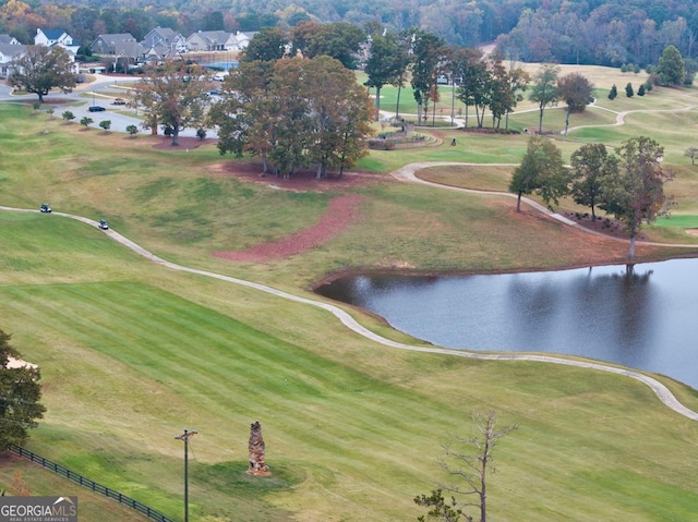 birds eye view of property featuring a water view and view of golf course