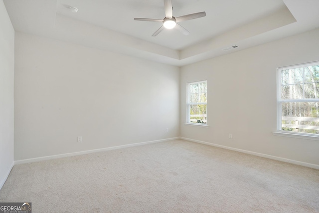 3891 Shelleydale Dr, Powder Springs, GA 30127 - spare room featuring light colored carpet, a raised ceiling, visible vents, and baseboards