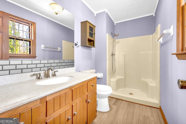 full bath featuring a shower, a textured ceiling, and wood finished floors