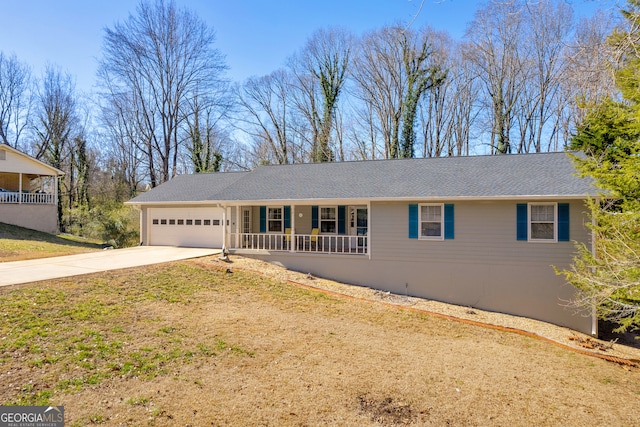 single story home with a garage, covered porch, driveway, and a front lawn