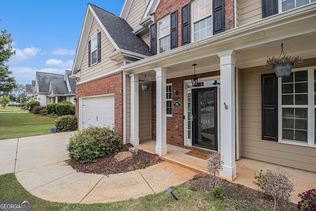 property entrance featuring brick siding, roof with shingles, and an attached garage