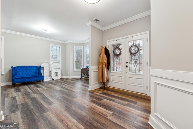 foyer entrance with dark wood-style flooring, french doors, visible vents, ornamental molding, and baseboards