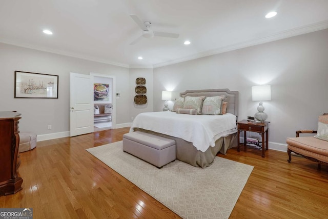 bedroom with crown molding, light wood finished floors, and baseboards