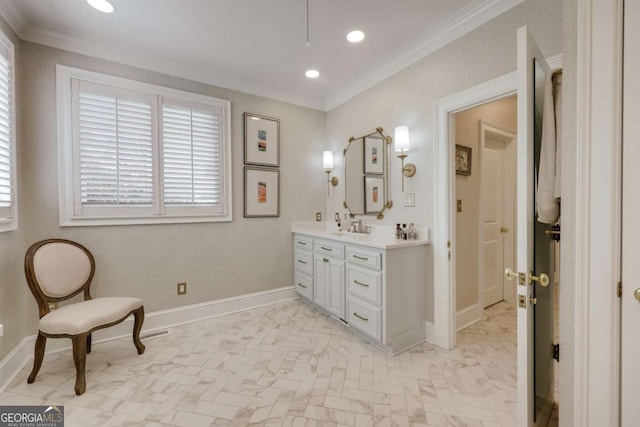 bathroom with baseboards, recessed lighting, vanity, and crown molding