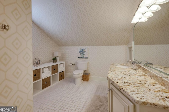 bathroom with wallpapered walls, baseboards, toilet, tile patterned floors, and vanity