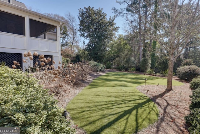 view of yard featuring a sunroom