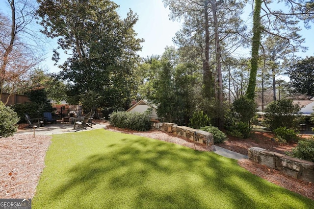 view of yard with a patio area and fence