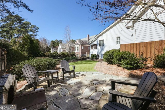 view of patio / terrace featuring fence