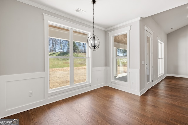 doorway with crown molding, visible vents, dark wood finished floors, and a notable chandelier