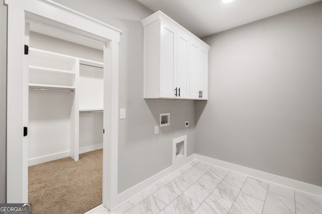 laundry room with cabinet space, baseboards, marble finish floor, hookup for a washing machine, and hookup for an electric dryer