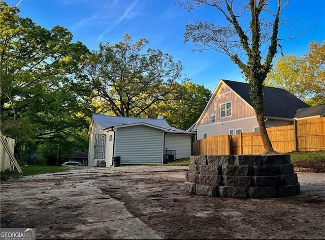 view of side of property with fence