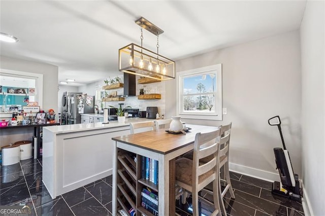 dining space with baseboards