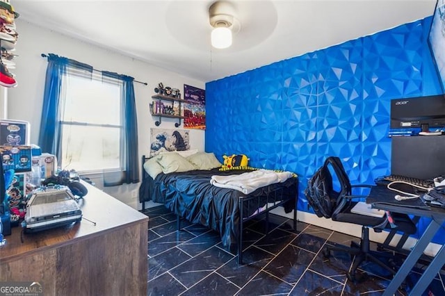 bedroom with a ceiling fan and marble finish floor