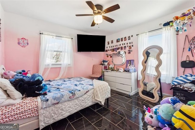 bedroom featuring marble finish floor and ceiling fan