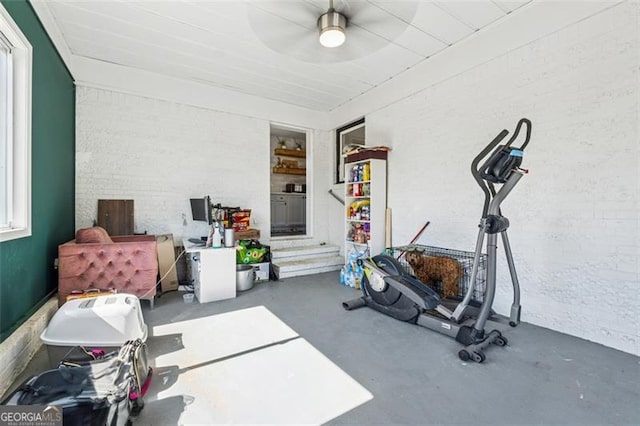 exercise room with brick wall