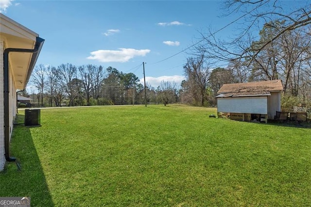 view of yard featuring central AC