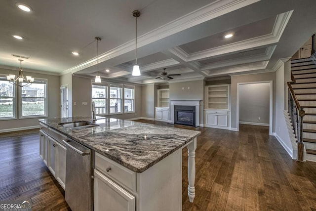 kitchen with a sink, open floor plan, dishwasher, an island with sink, and pendant lighting