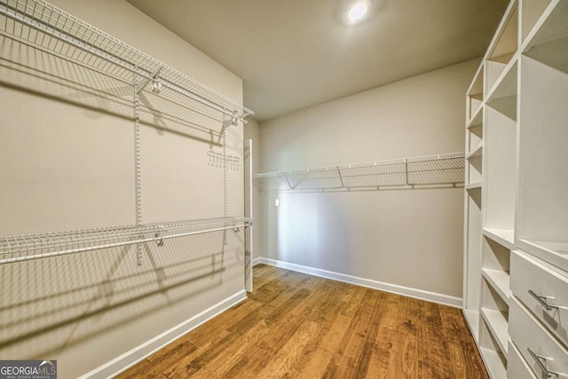 spacious closet with wood finished floors